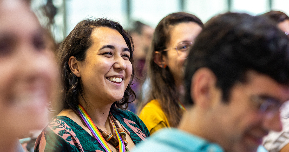 Smiling woman in crowd