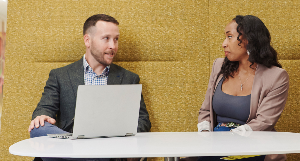 Photo of two people in conversation