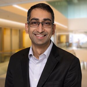 BMS Drug Development leader, Nataraj Kalyanaraman, in a dark blazer and wearing glasses