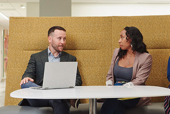 Photo of two people in conversation