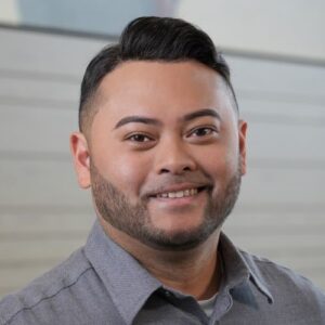 BMS employee Rajh Odi in a grey dress shirt