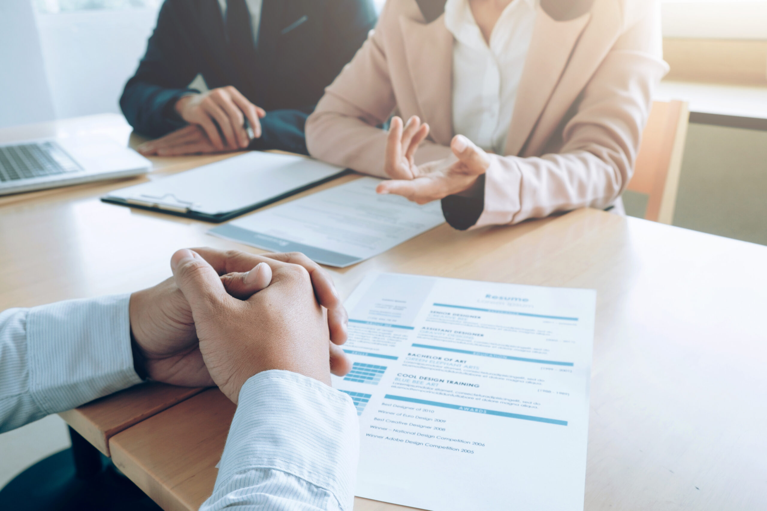 Candidate with resume being interviewed
